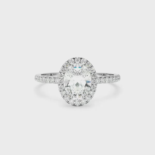 Oval Cut Diamond Halo Engagement Ring With Pave Band