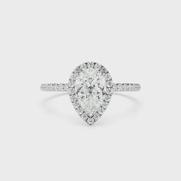 Pear Cut Diamond Halo Engagement Ring With Pave Band