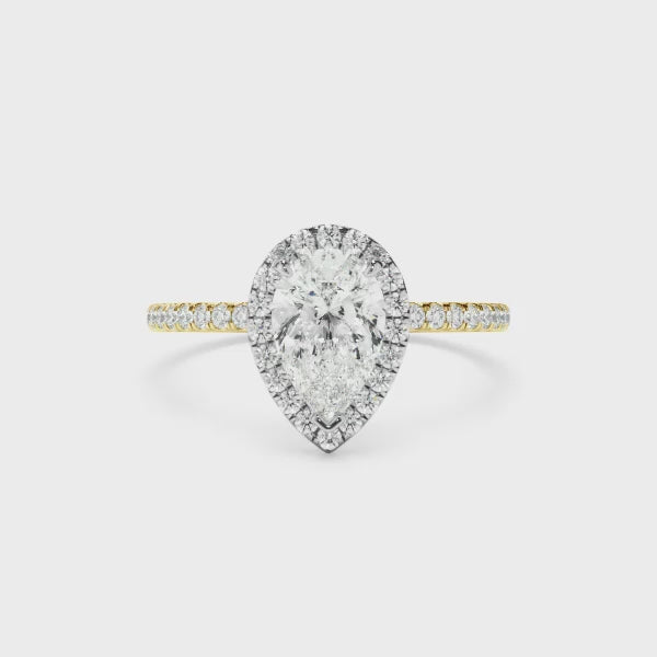 Pear Cut Diamond Halo Engagement Ring With Pave Band